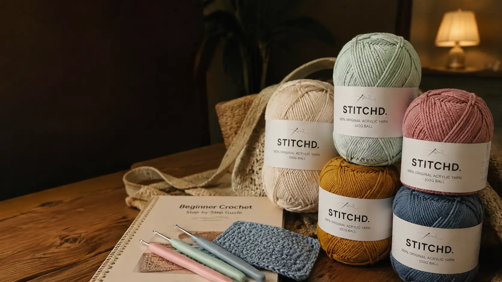 STITCHD beginner kit with five yarn balls and three crochet hooks